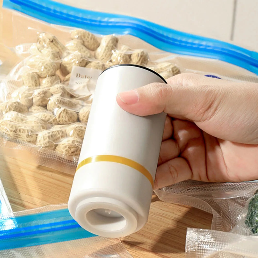 https://ae01.alicdn.com/kf/Sd6f74ad6741a417197574d2fc3543402b/Mini-Vacuum-Sealer-Portable-USB-Electric-Air-Pump-Mini-Fresh-Keeping-Handheld-Vacuum-Sealing-Machine-Packaging.jpg